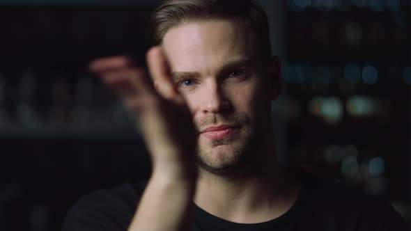 Portrait of Handsome Young Man Swiping on Invisible Multi Touch Screen in Office