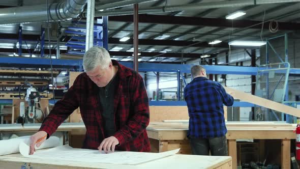 Carpenter at work in woodshop