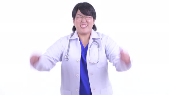 Happy Overweight Asian Woman Doctor Getting Good News