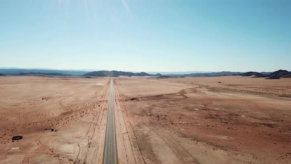 Namibian Road in Kalahari Desert in Africa. Aerial Drone Shot. Lanscape of the Road in the Desert. V