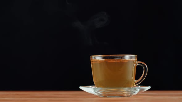 Hot Green Tea on Black Background