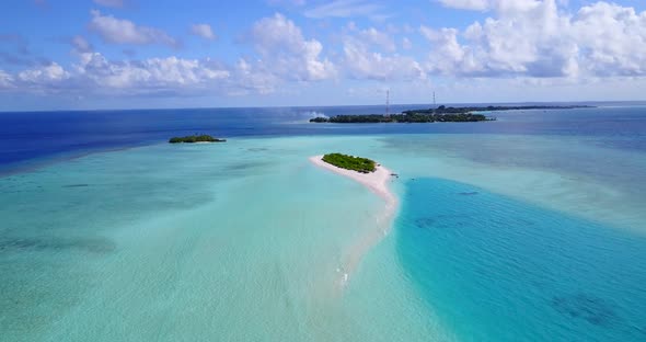 Daytime birds eye copy space shot of a summer white paradise sand beach and blue ocean background in