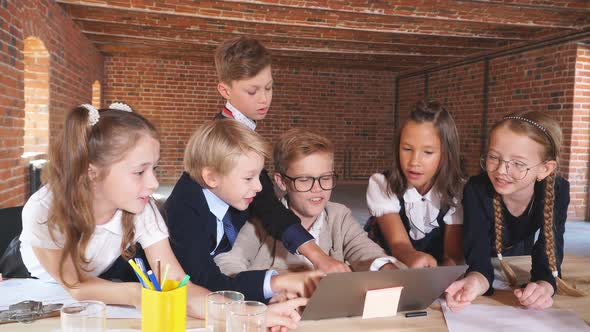 Clever Children Cracking the Code, Little Bloggers Sitting at the Laptop