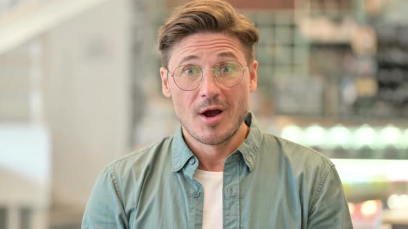 Portrait of Positive Middle Aged Man Saying Yes By Shaking Head