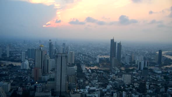 Panning high view of the city in sunset time