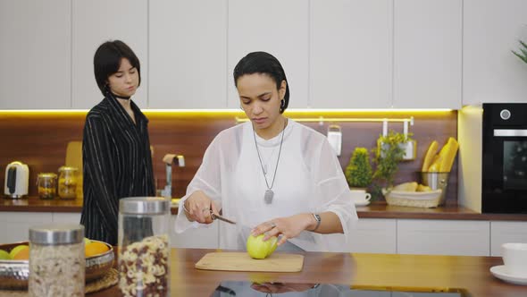 Cute Lesbian Couple in the Kitchen at Their Home