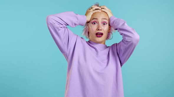 Frightened Hipster Woman Shocked Isolated Over Blue Background. Stressed and Depressed Girl Because