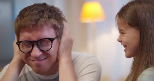 Stubborn Child Girl in Tantrum Screaming at Young Father