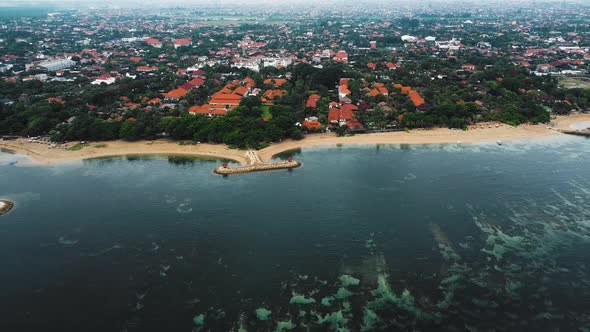 Beautiful cinematic Sanur beach, Bali drone footage with interesting landscape, fishing boats, resor