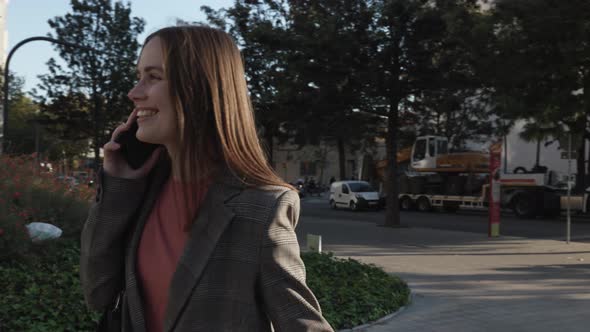 Smiling Young Business Woman Professional Talking on Phone in City Street