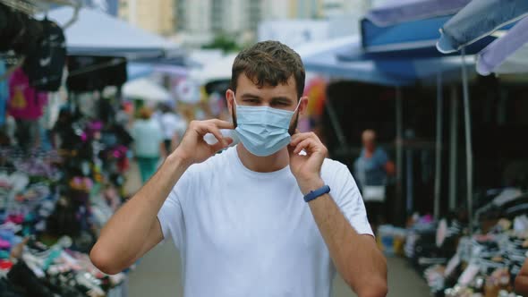 Male Portrait Put on Coronavirus Face Mask in Asian Market Under Covid Pandemic