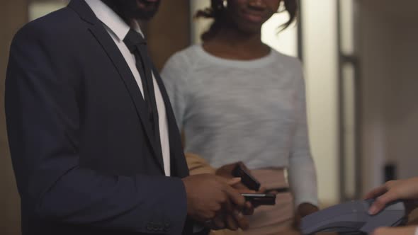 Guests Checking Into Hotel