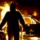 The burning man moves away from the burning car. The man is on fire - VideoHive Item for Sale