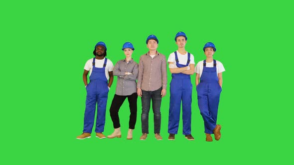 Group of Construction Workers Standing with No Emotions Looking to Camera on a Green Screen Chroma