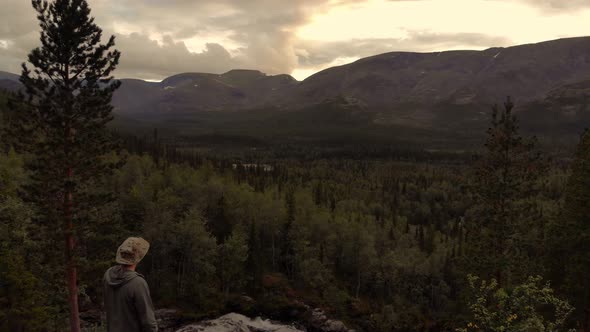 A Traveler Admires a Beautiful View of the Natural Landscape