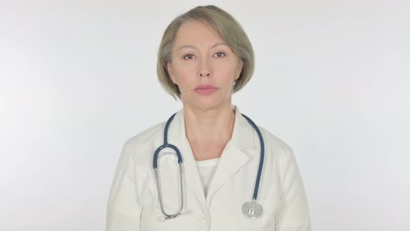 Serious Old Female Doctor on White Background