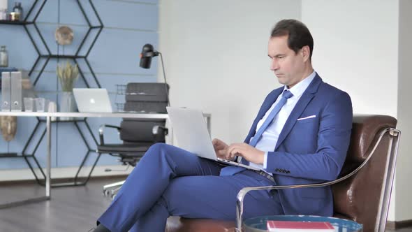 Businessman Working on Laptop