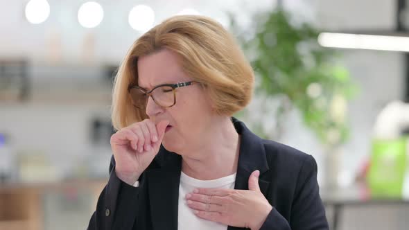 Portrait of Sick Old Businesswoman Coughing