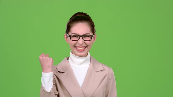 Girl Rejoices in Victory. Green Screen. Slow Motion