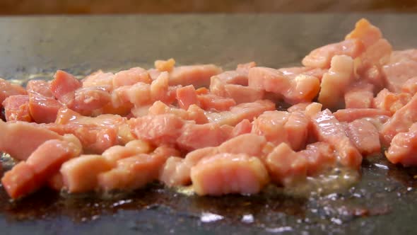 Closeup Panorama of the Minced and Smoked Bacon Roasting on the Flat Grill