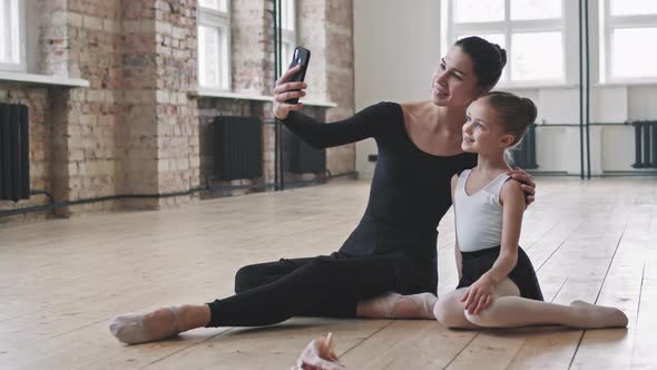 Adult And Little Ballerinas Taking Selfie