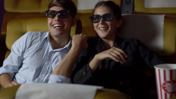 Man and Woman in the Cinema Watching a 3D Movie