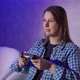 A Young Woman is Playing a Game Console - VideoHive Item for Sale