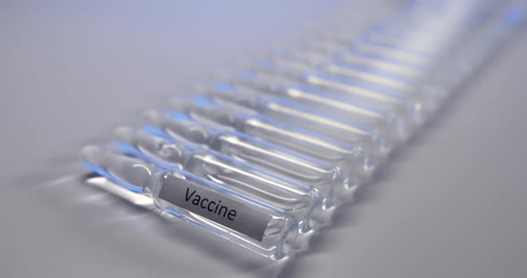 The Camera Captures the Light Illuminating the Vaccine Vials