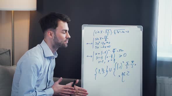 Young Man Mathematics Teacher Makes a Lesson Online Live Broadcast of the Learning Process