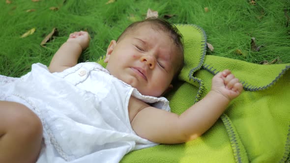 Cute Infant Baby Sneezes Two Time Loudly in Slow Motion, Close-up View, Dreamy Newborn Baby Infant