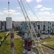 Chimney Pipe Construction, the Crane Lifts the Pipe Segment. Aerial Shot - VideoHive Item for Sale