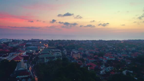 Flight Over The City At Sunset, Indonesia