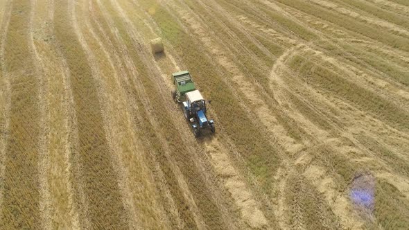 Aerial Dron Footage of Tractor Hay Harvesting