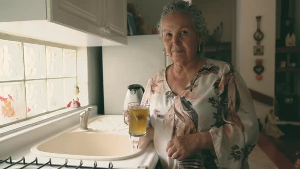 Woman making tea with tea bag