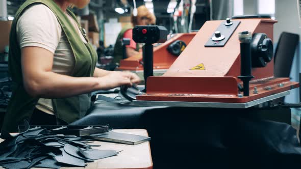 Footwear Factory Workers are Cutting Out Patterns for Boots