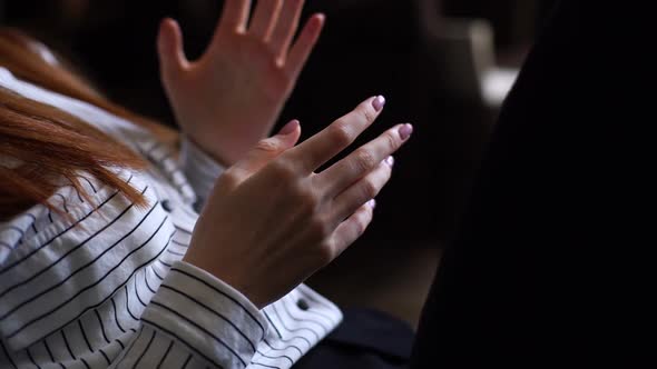 Close-up of Unrecognizable Young Woman Moving and Gesturing Hands During Meeting.