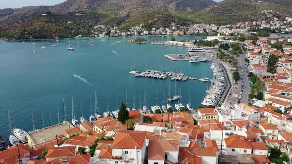 Aerial View of Poros Old Town and Marina or Seaport Greece  Drone Videography