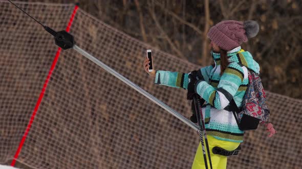 Amateur Skier Girl on a Lift