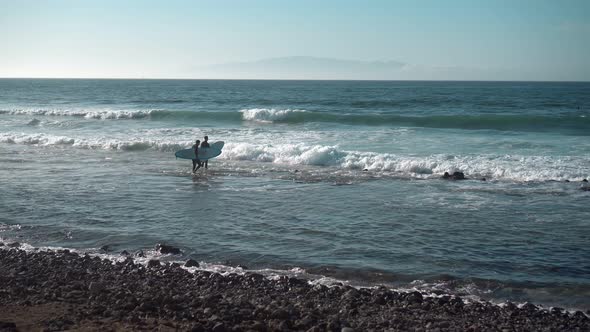 Surfers on Ocean Coast