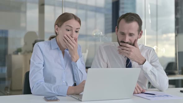 Executive Business People Celebrating Success While Working on Laptop