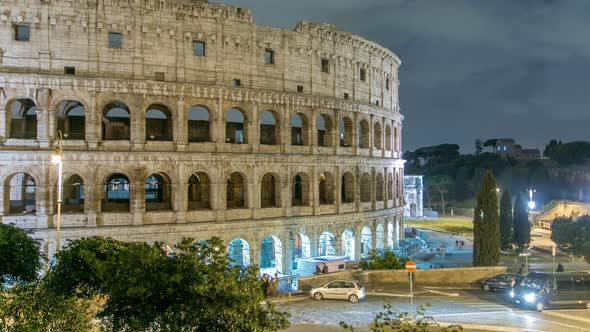 View of Colosseum Illuminated at Night Timelapse in Rome, Italy