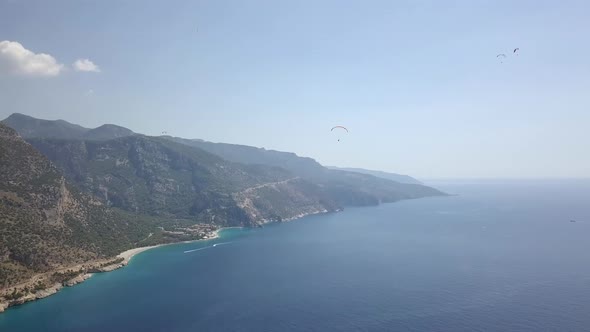 Paragliders Flying Over Sea and Beach on Resort