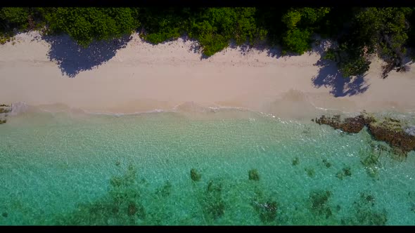 Aerial view texture of beautiful tourist beach voyage by blue ocean and white sandy background of a 