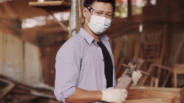 Asian carpenters in a construction workshop. business man working woodwork