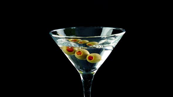 Martini Cocktail Poured and Olives Added