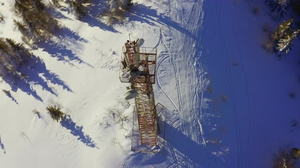 Flying Over Radio Communications Tower Mountain Snow Covered Winter Landscape