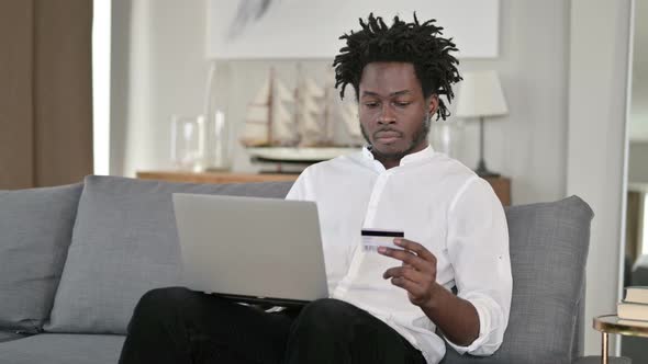 Online Payment Loss on Laptop By African Man at Home 