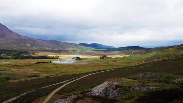 Drone timelapse of fire in scottish highland mountain landscape. Aerial video shot by a drone in Sco