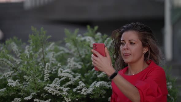 Woman is Communicating By Video Call Sitting Outdoors Wireless Internet Connection for Video Chat