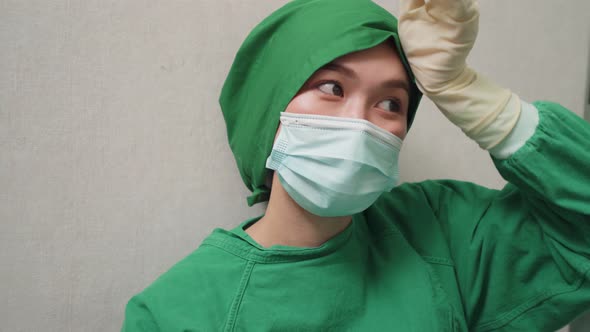 Asian young woman doctor nurse take a break sitting  and take a rest after hard work in hospital.